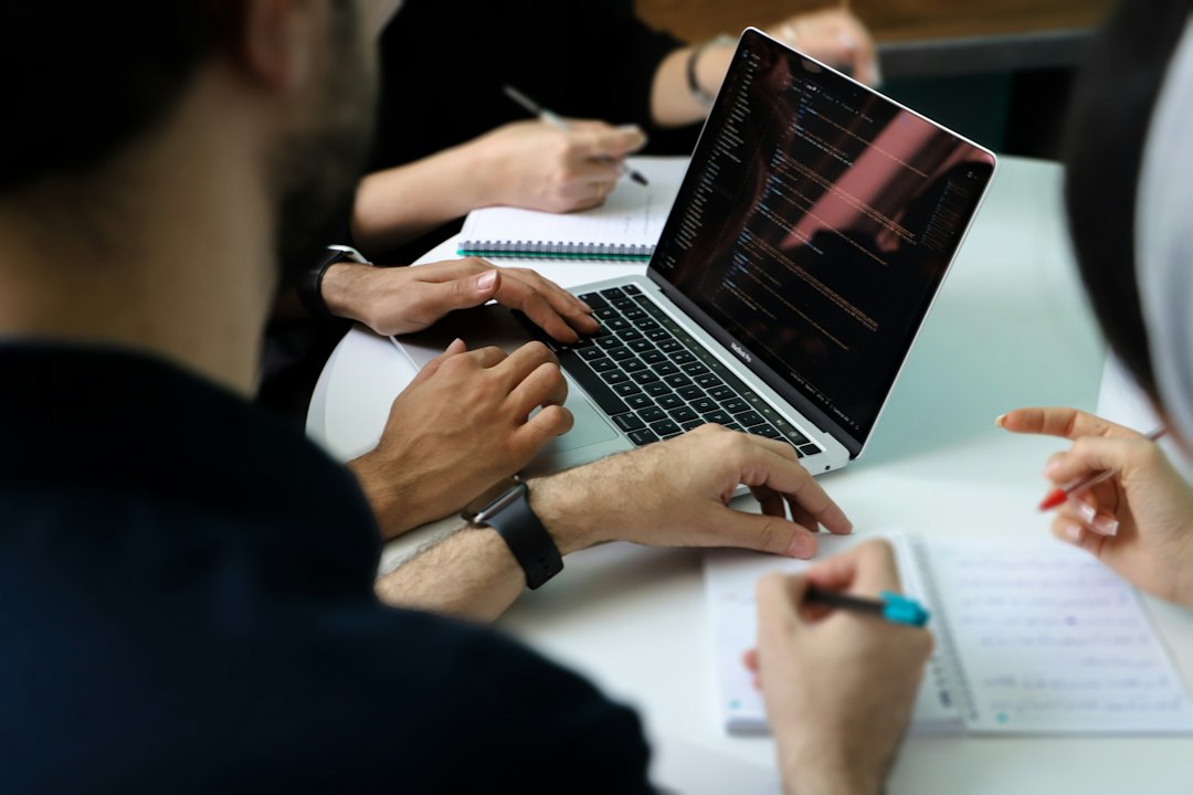 Business team working together around a laptop